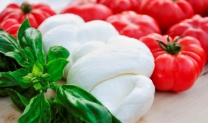 Delicious bulls heart (or heirloom) tomatos with fresh green basil